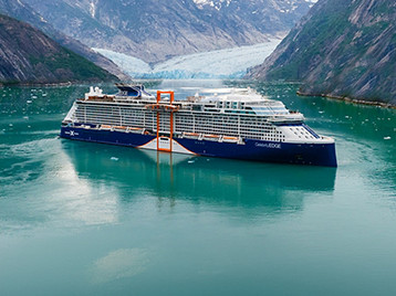 Celebrity Cruises ship sailing through an Alaskan fjord