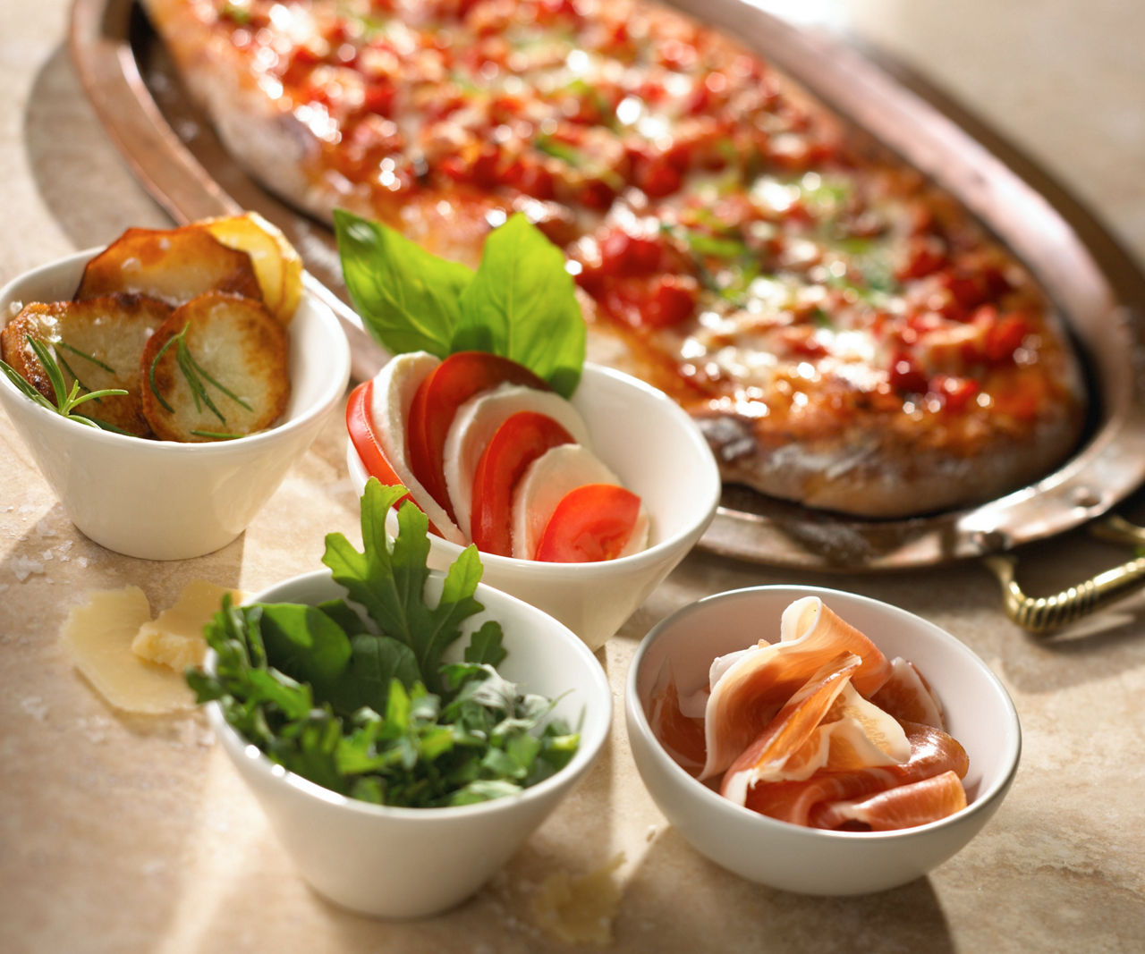 Flat Italian bread with potatoes and herb, marinated artichokes, olives & pesto. Cruise fine dining at Giovanni's Table.