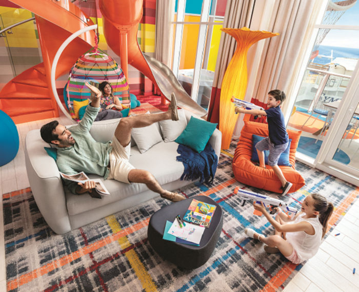 SY, Symphony of the Seas, UFS, Living Room, Ultimate Family Suite, Foam Dart Gun, Playing, Family fun, kids, mom, dad, family bonding, balcony in background,