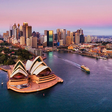 Sydney skyline and harbour waterfront at sunset