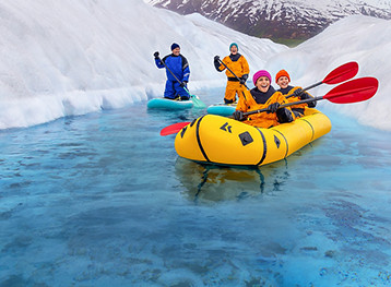 Couple rafting along the Glaciers in Alaska