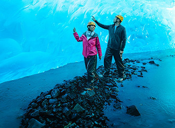 Couple walking at a Glacier in Alaska