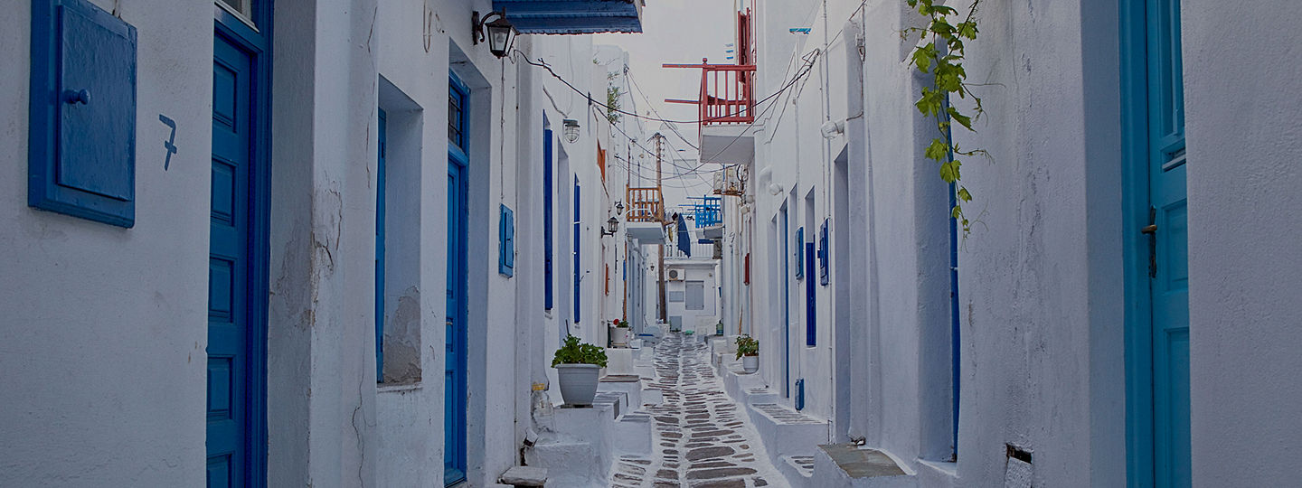 a white and blue alley in Mykonos