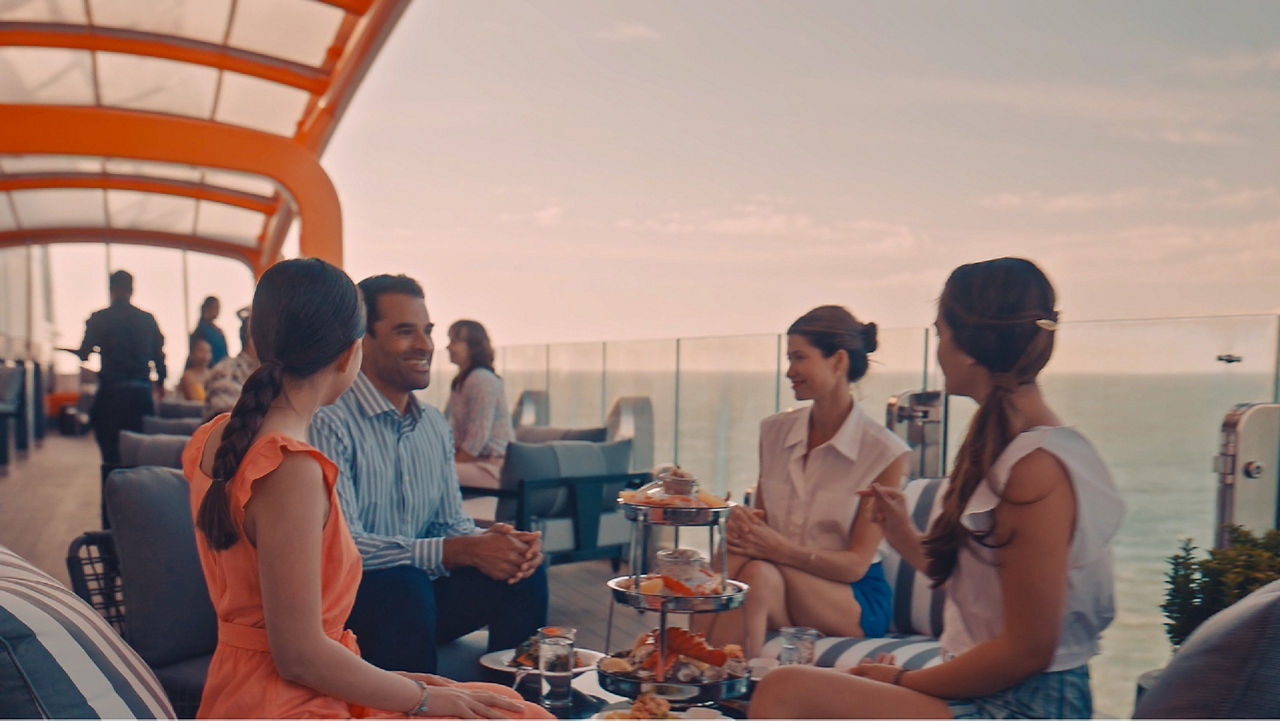 group of friends enjoying food in the Magic Carpet