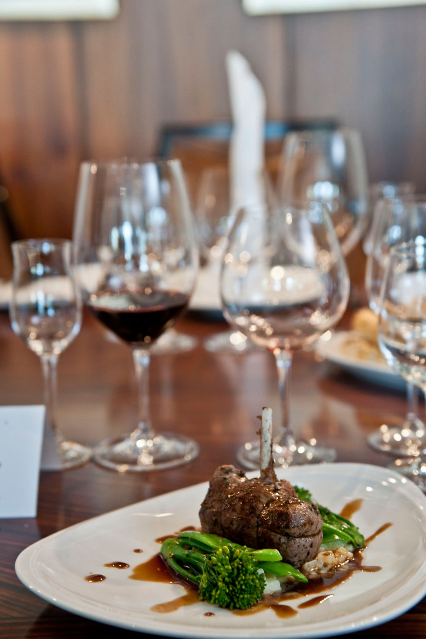 Lamb Cutlet & Vegetables at the elegant Chefs Table restaurant. Enjoy cruise line fine dining menu with artisanal ingredients