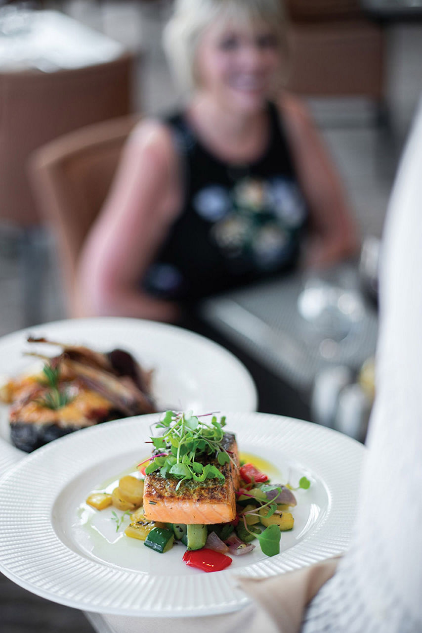 Oasis Class, Symphony Of The Seas, Waiter Bringing a Plate of Salmon, Coastal Kitchen.
