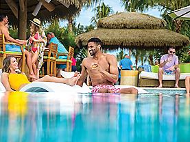 people in coco beach club infinity pool perfect day at cococay 2560x1440