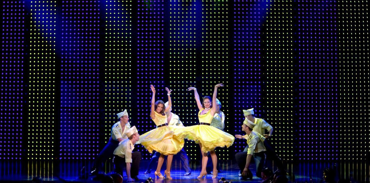Performers dancing on stage during Invitation to Dance Cruise Show on Independence of the Seas