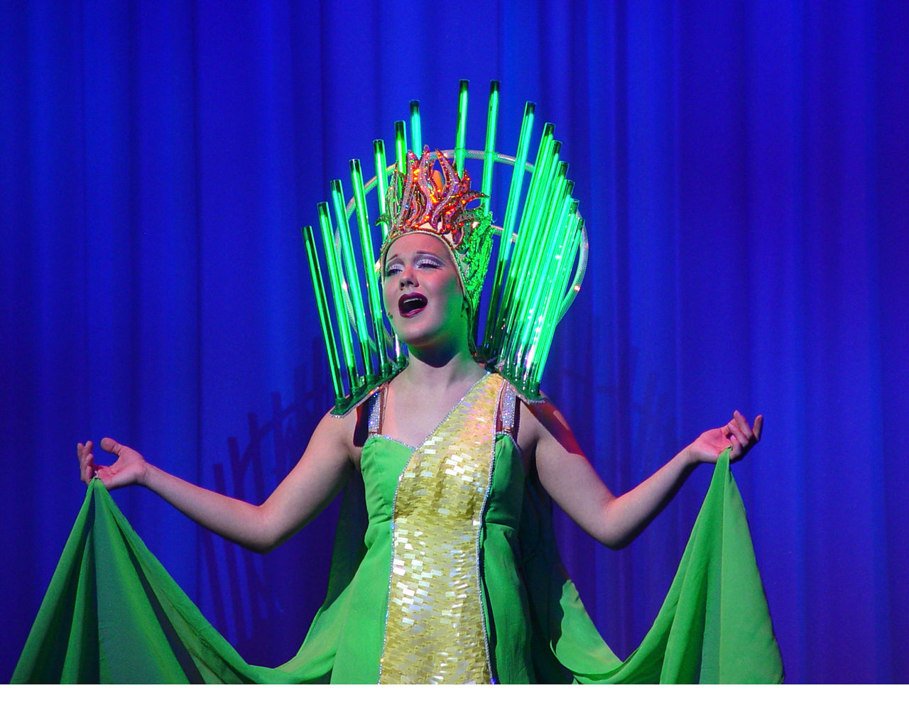 Performer singing on stage during Piano Man Show in Radiance of the Seas