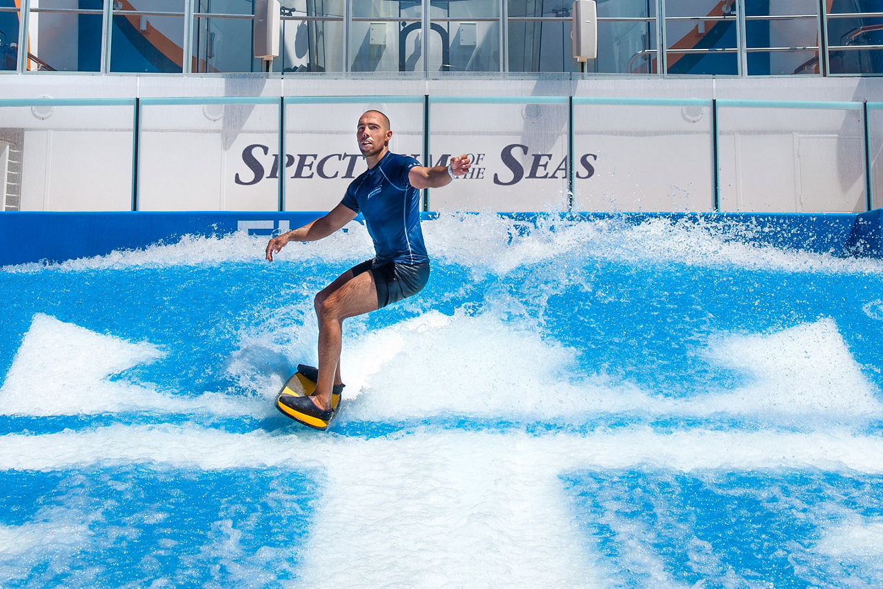 Spectrum of the Seas Flowrider Man Riding Waves