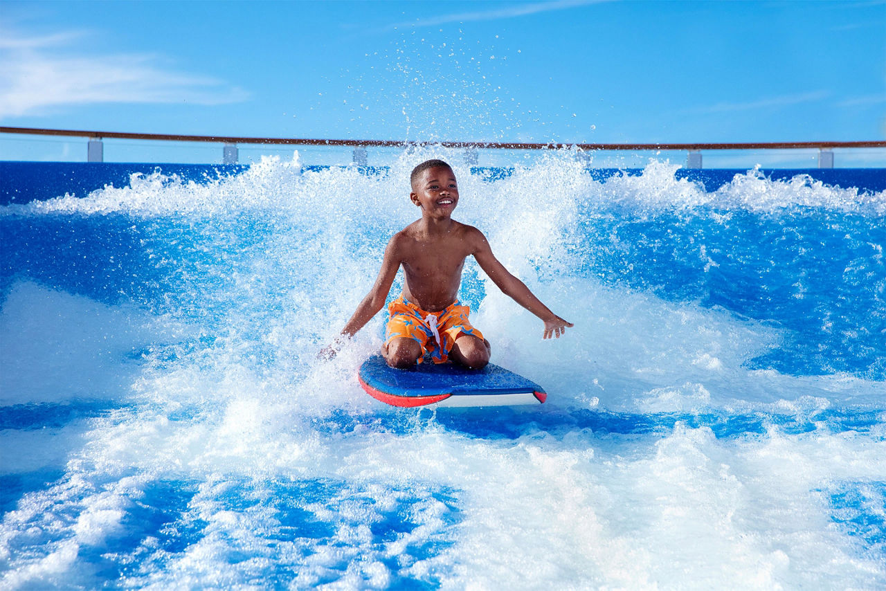 Boy Enjoying Flowrider with Boogie Board