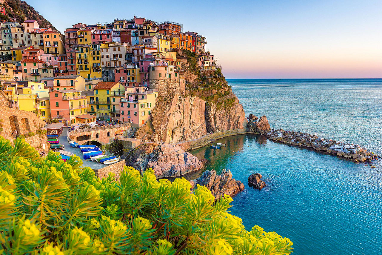 Multicolored homes lining a cliff at an Amalfi Coast city