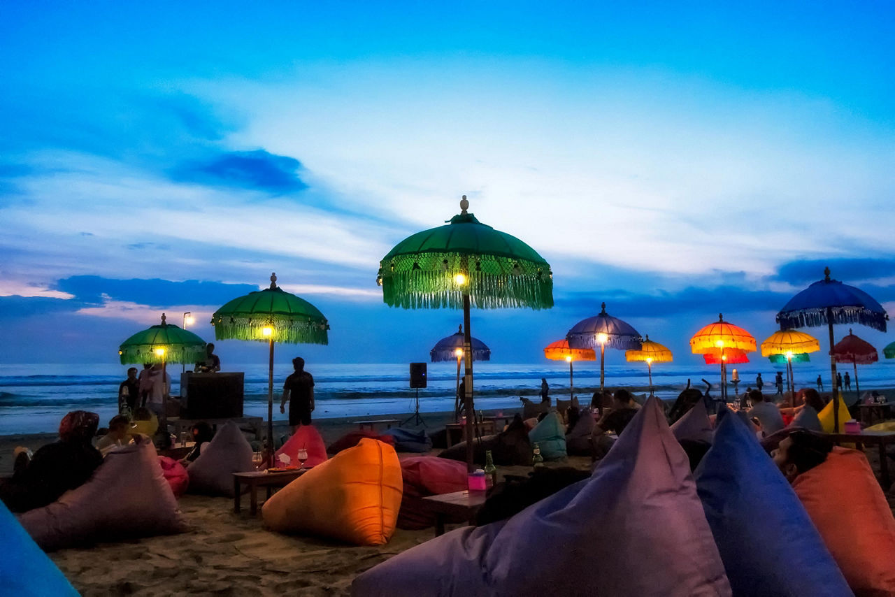 Hang out spot on the beaches of bali with pillows and lights
