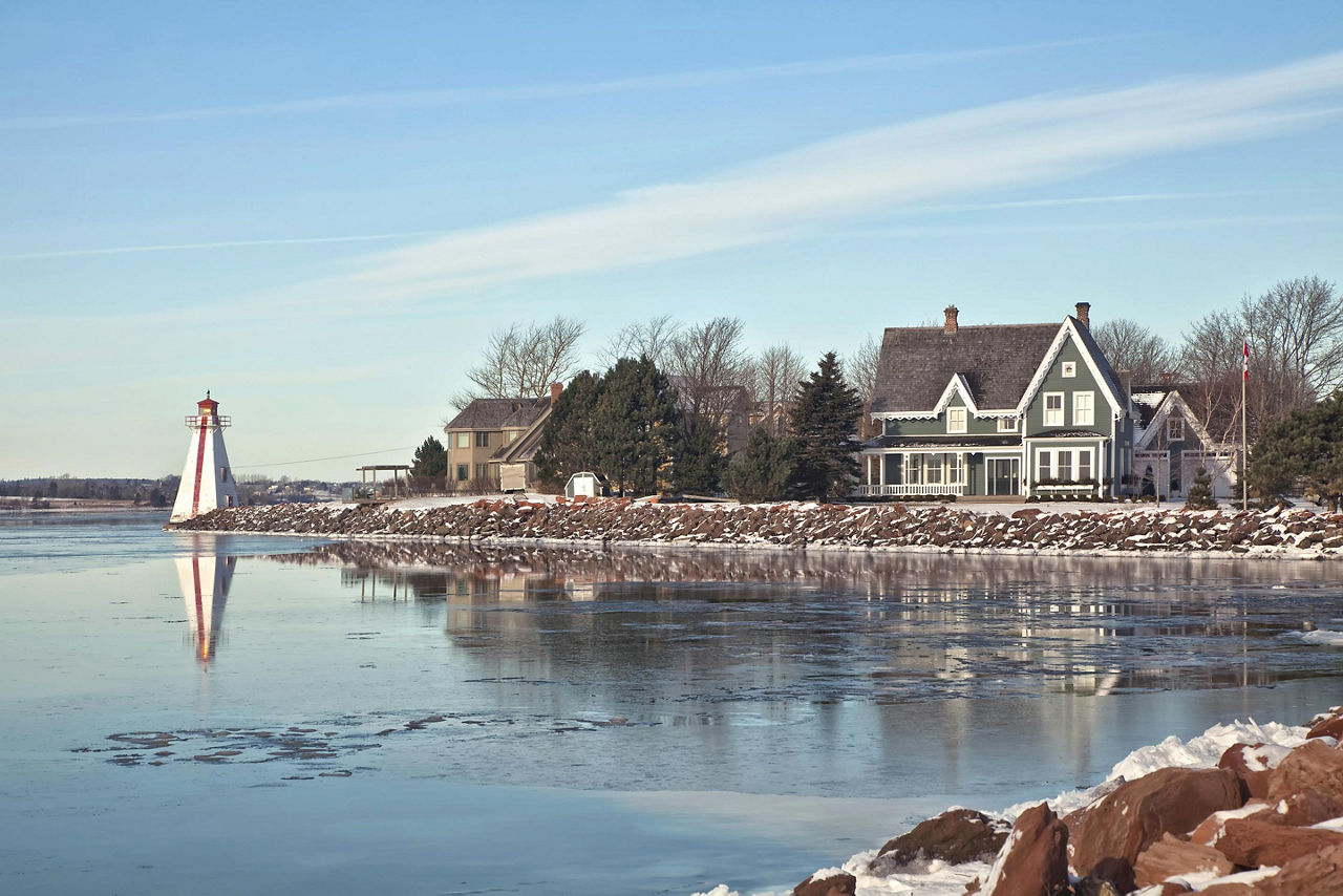 A waterfront home and lighthouse in Charlottetown, Prince Edward Island 