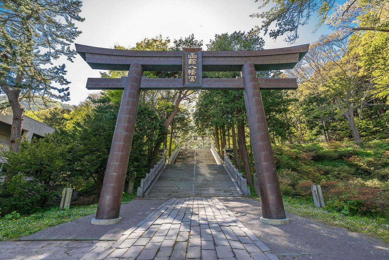 A Torii gate with stairs leading to the Hakodate Hachiman shrine in Hakodate, Japan