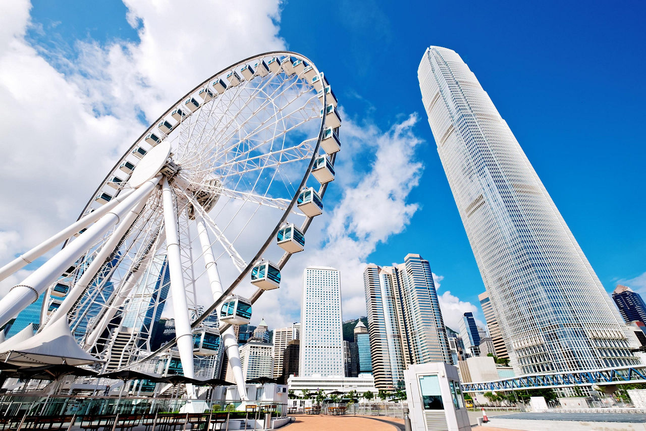 Ferris wheel and skyscrapers during the day in Hong Kong, China