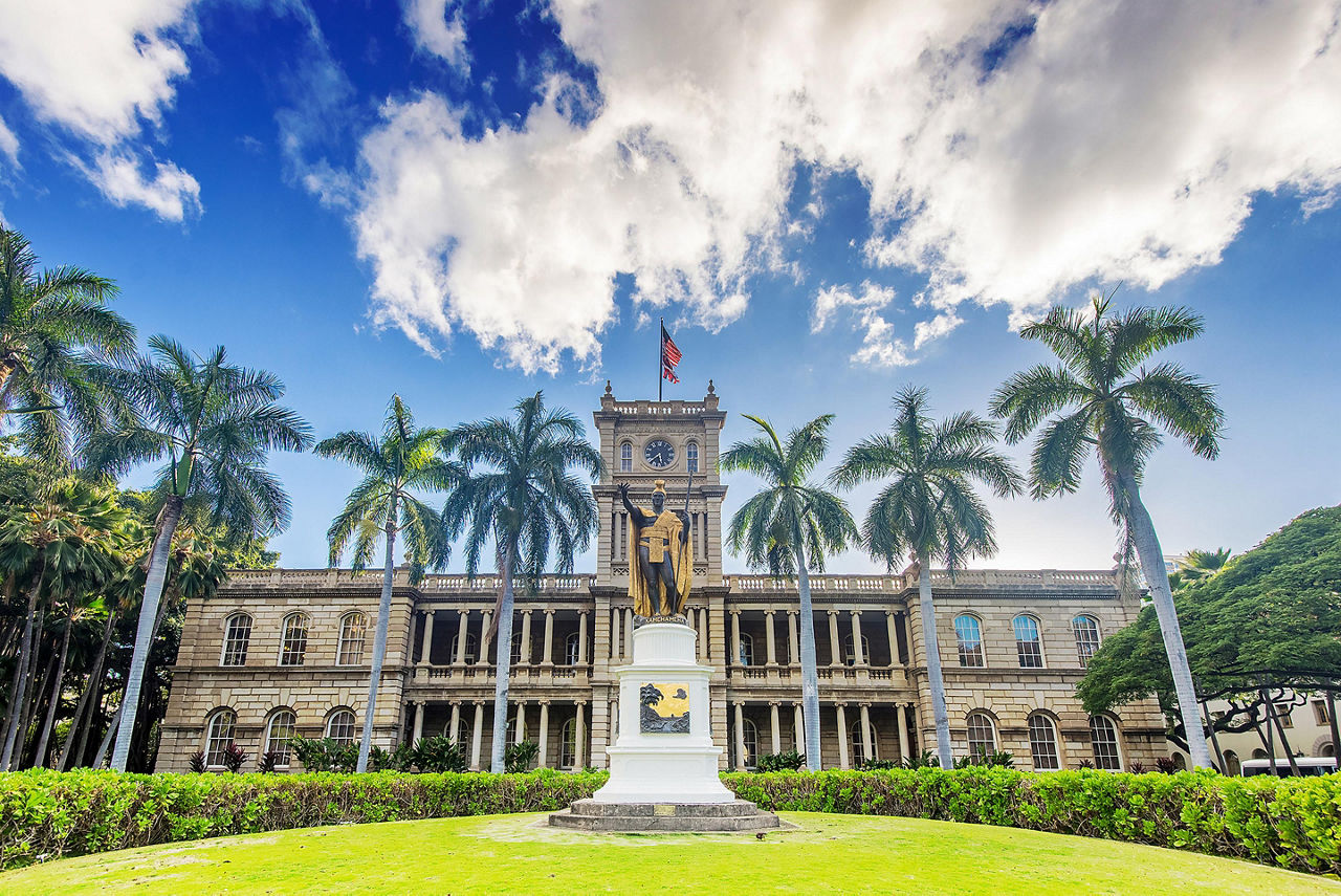 A statue of King Kamehameha in front of the Iolani Palace in Honolulu, Hawaii