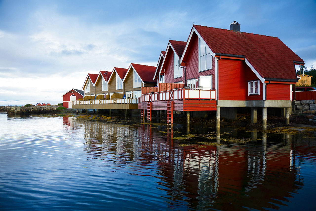 Red homes on the water in Molde, Norway
