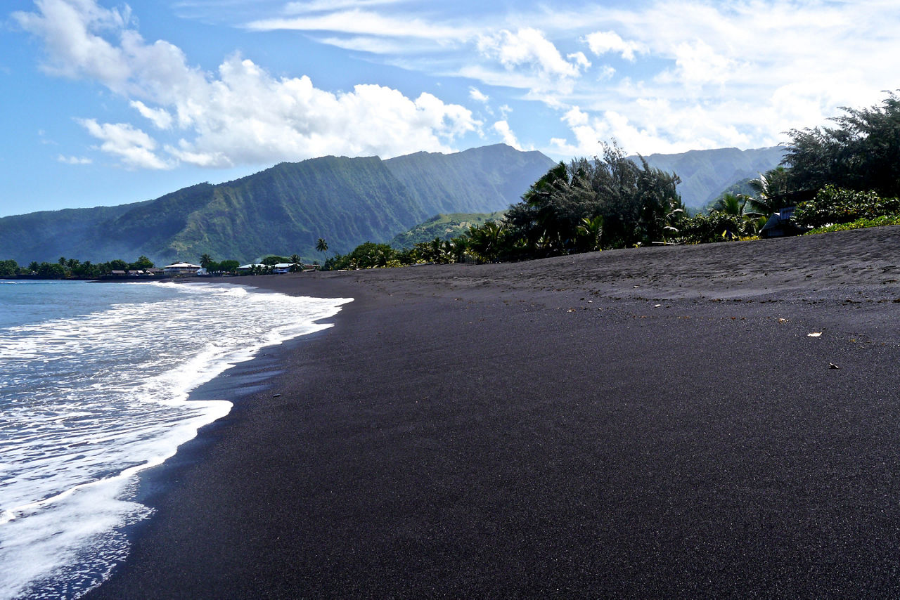 A black sand beach in Papeete, Tahiti