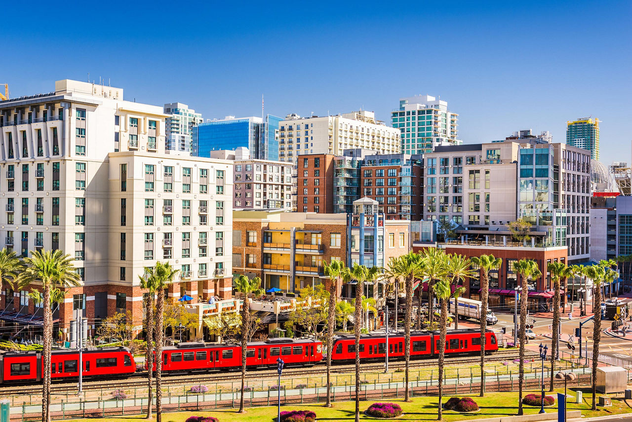 Gaslamp Quarter cityscape with red train in San Diego, California