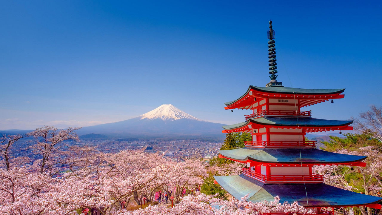 The upper levels of Chureito Red Pagoda with Mount Fuji in the distance
