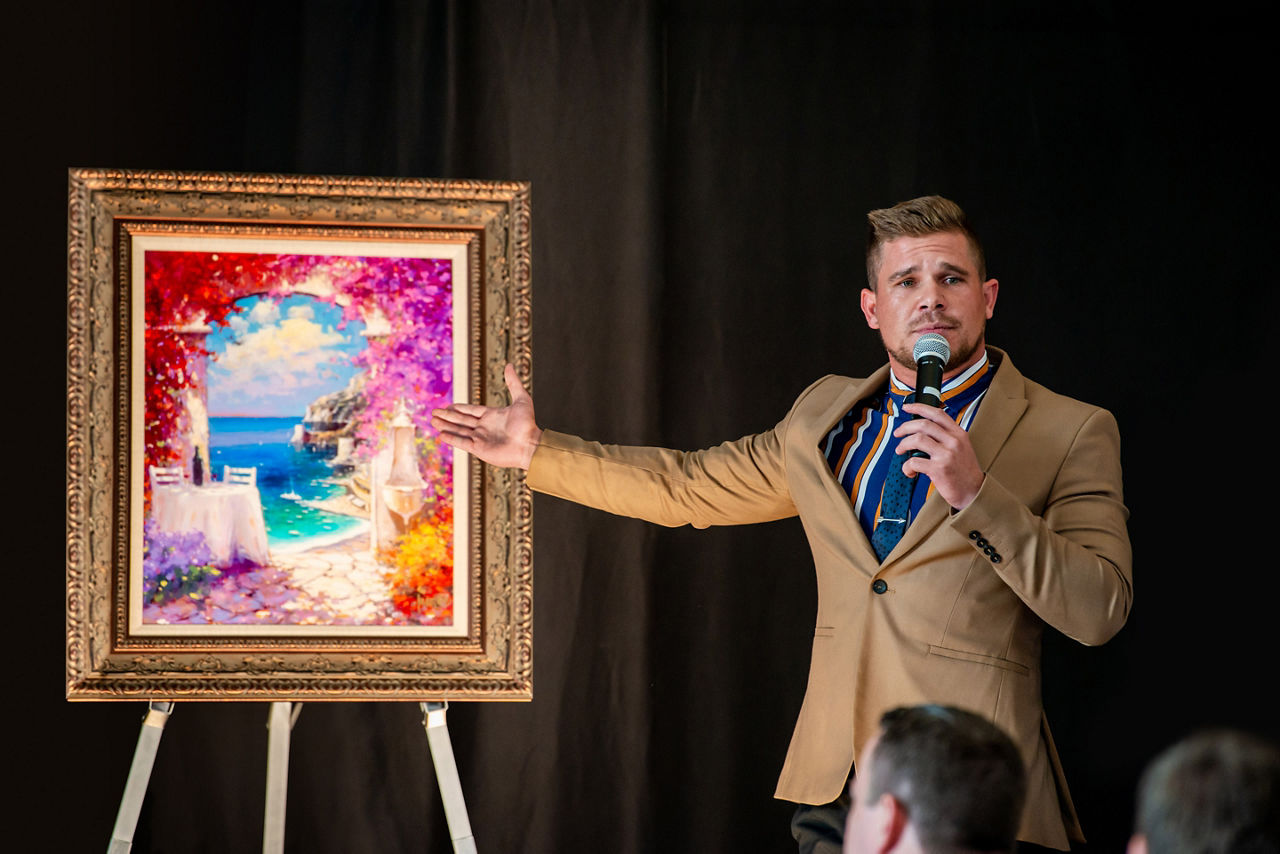 Man Auctioning Painting