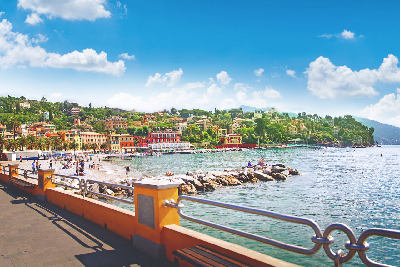 Beautiful view of the sea embankment with yachts, rocky coast in the city of Santa Margarita, Italy, panorama