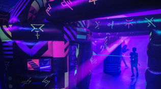 Kid playing laser tag onboard Symphony of the Seas