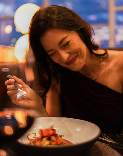 A guest enjoying specialty dining on a Celebrity Cruises ship.