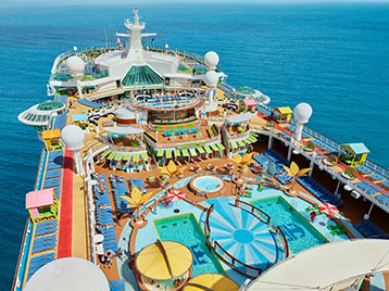 Freedom of the Seas sailing through open waters with its iconic pool deck, offering European cruise holidays to popular Mediterranean destinations. Discover Freedom of the Seas Europe cruises.