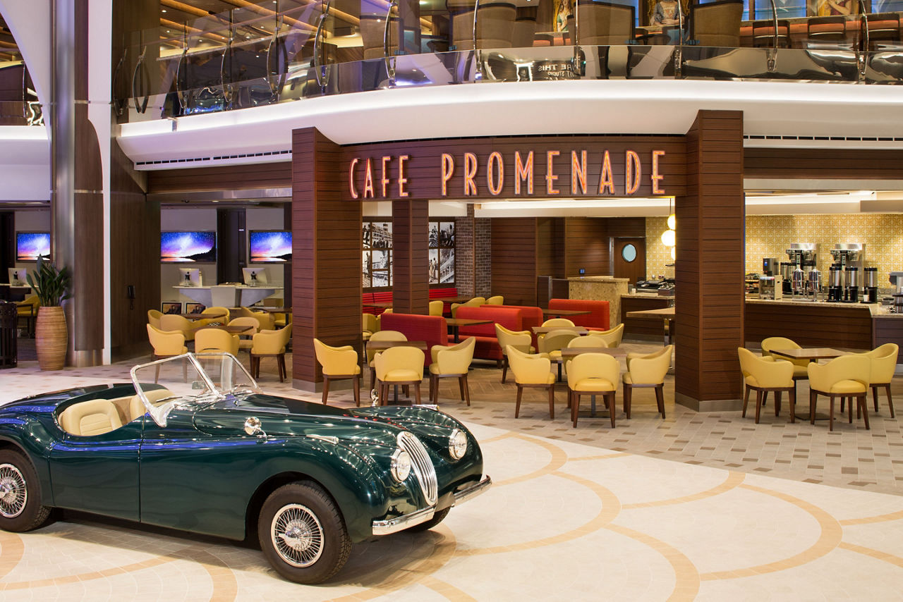 HM, Harmony of the Seas, Cafe Promenade, Deck 5 Midship,  Royal Promenade, no people, exterior, sports car, tables and chairs, signage,