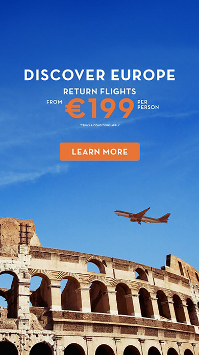 Airplane flying over The Colosseum 
