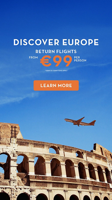 Airplane flying over The Colosseum 