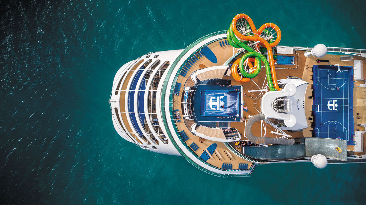 An aerial view of the aft of the Liberty of the Seas showing the Flowrider® and The Perfect Storm℠ waterslides