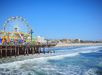 View of the ferris wheel and roller coaster on the Santa Monica pier in California