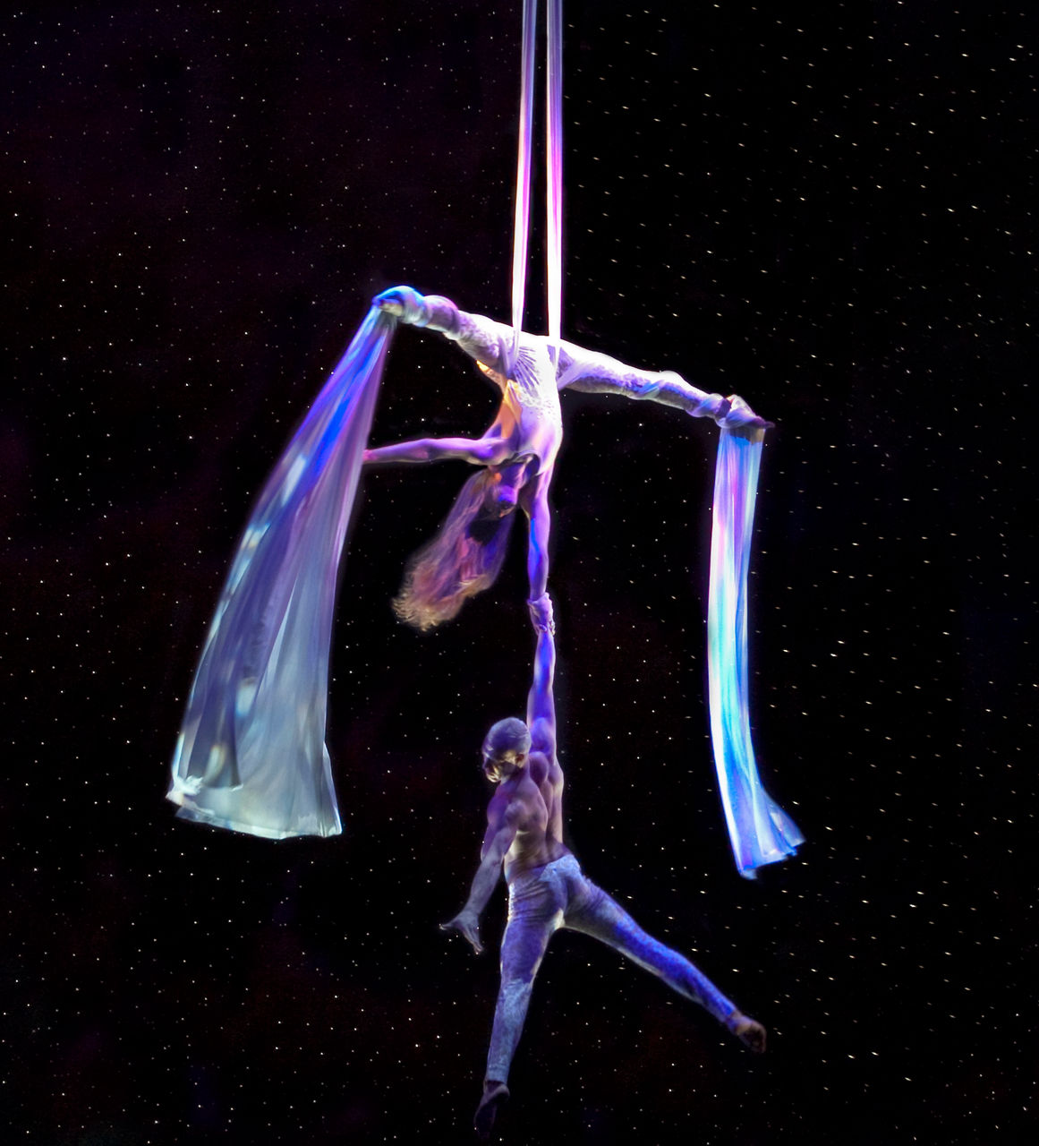 Oasis Class, Oasis of the Seas, Two performers on stage doing a stunt during the Come Fly With Me Cruise Show