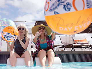 a couple relaxing in the retreat sundeck