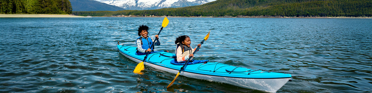 Mother and Daughter Enjoying a Kayak Tour in Alaska