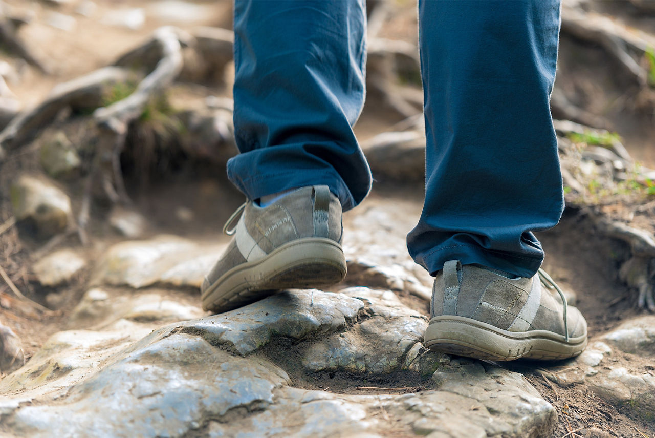 Female foot hiking a terrain
