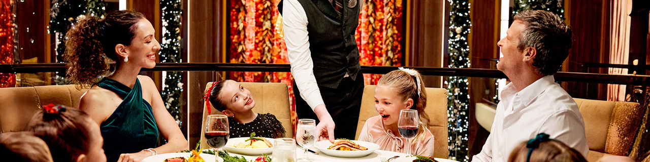 Family being served holiday dinner at Main Dining Room
