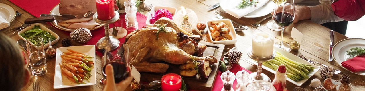 Family Discussing Volunteering during the Holidays while Eating Turkey Dinner