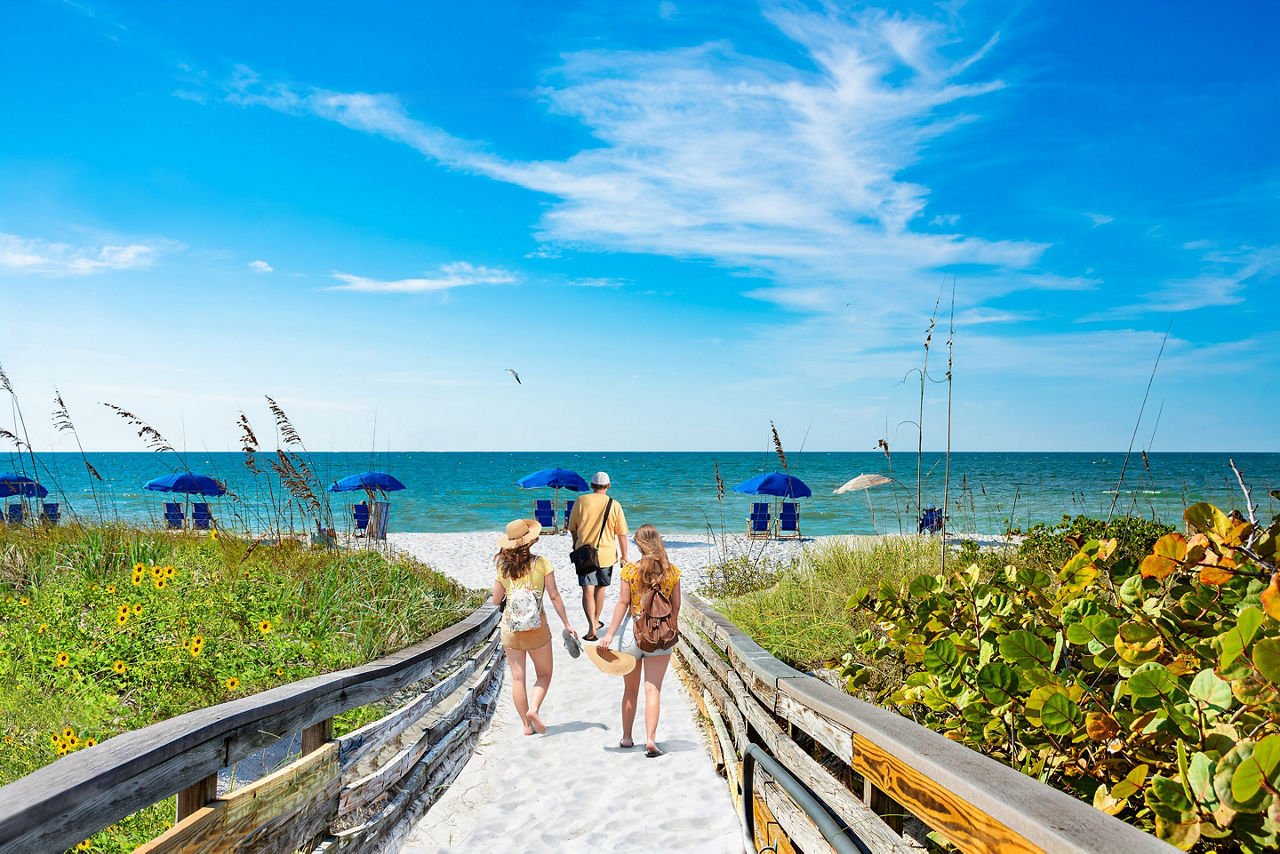 Family on summer vacation trip in Caladesi Island State Park, Florida.