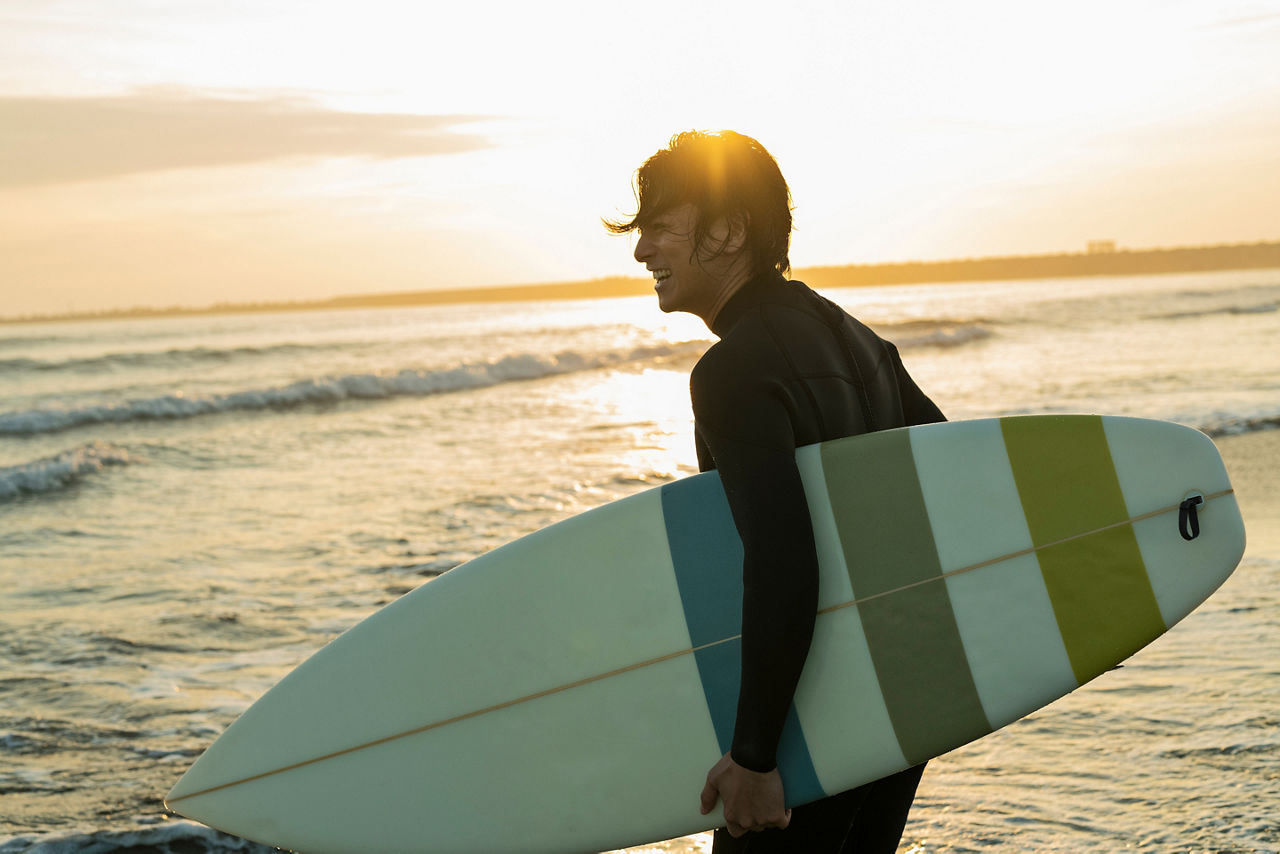 Man surfing in the morning ocean