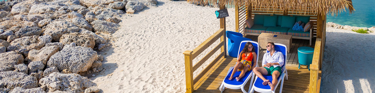 Chill Island Beach Couple Enjoying the Beach Cabana