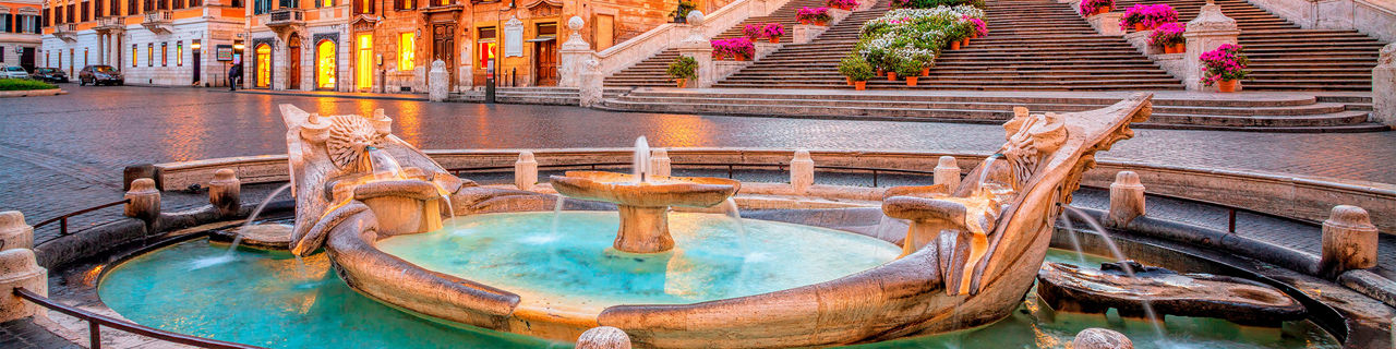 the golden fountain of the Piazza de Spagna at sunrise. Europe.