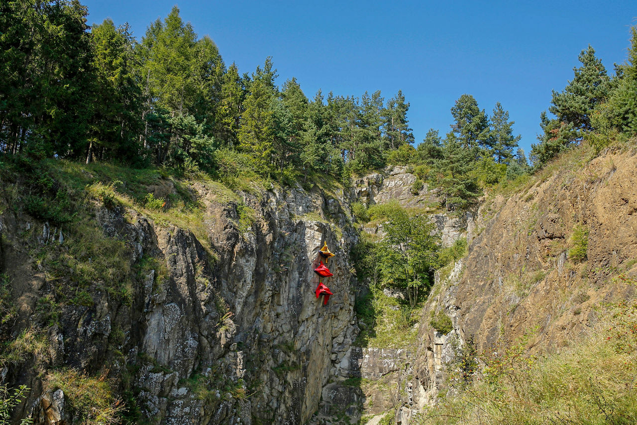 Colorful portaledge hanging tents for rock climbers