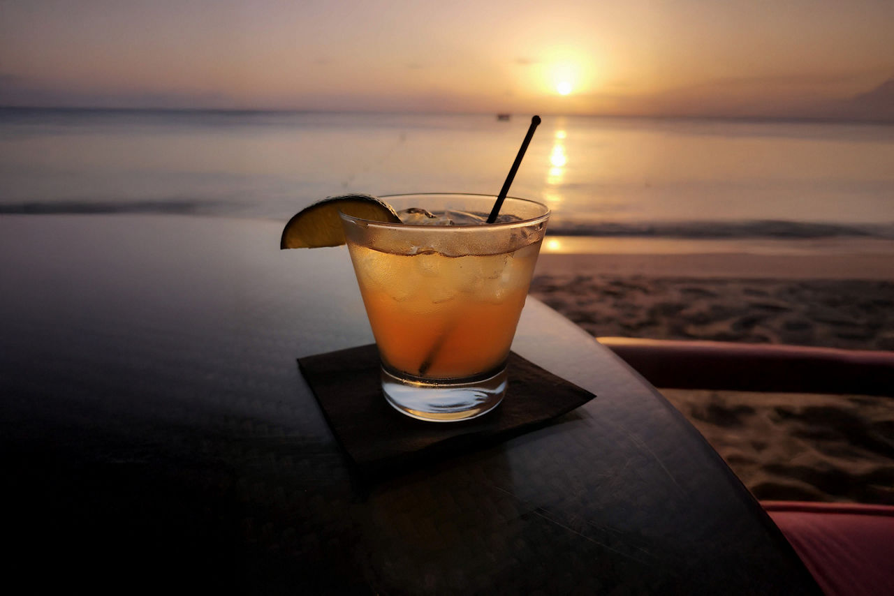 Rum punch cocktail at sunset, Paynes Bay, Barbados