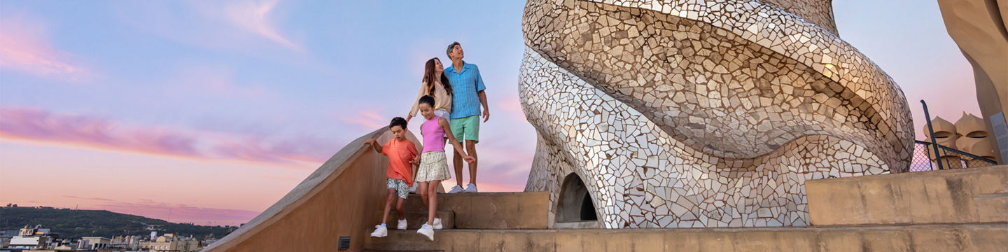 Family explores Casa Milà at sunset. - Barcelona, Spain