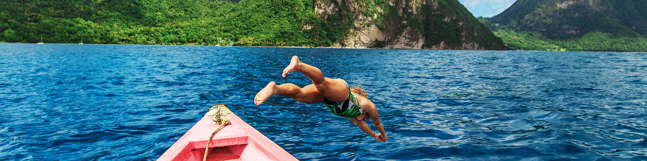 st lucia the pitons man jumping off boat 1920 480