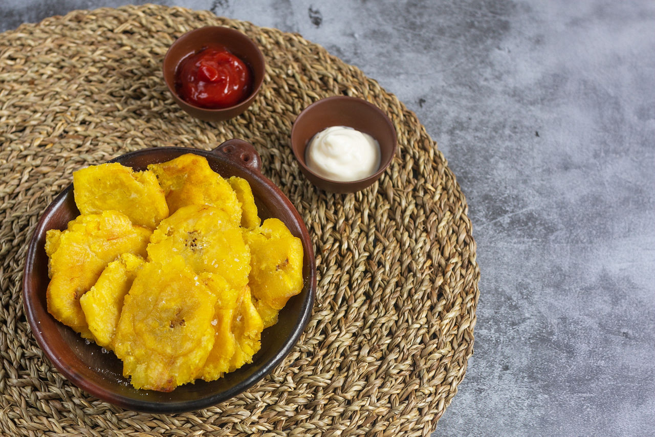 Traditional Dominican toston, snack made of green fried plantain side dish.